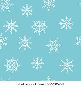 Snowflake vector pattern. Blue background with white snowflakes. delicate snowflakes