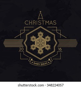 Snowflake winter christmas golden logotype on black background