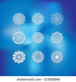 Snowflake winter set nine icon silhouette with shadow on a blurred vector background