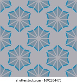 Snowflakes blue and grey pattern on light background. Seamless design.