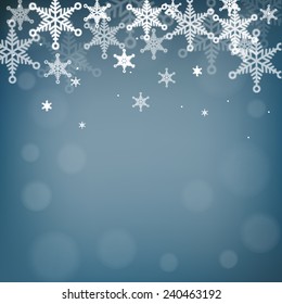 Snowflakes and bokeh on blue background.Vector eps10.