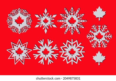 Snowflakes with a carved maple leaf as a Christmas decoration with the symbol of Canada and a maple leaf.