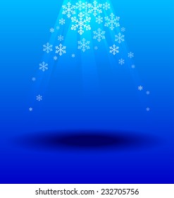 Snowflakes crystal under light on blue background