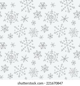 Snowflakes. Cute seamless pattern of snowflakes hand-drawn. Christmas background. Can be used for greeting cards, wallpaper, fabric printing and scrapbooks. Monochrome.