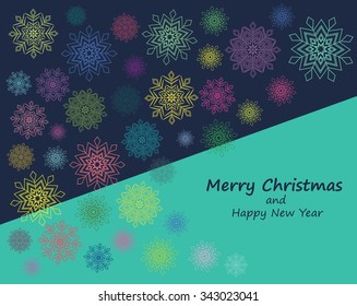 Snowflakes in different colors on blue background. Merry Christmas and Happy New Year card.