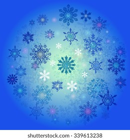 Snowflakes of different shapes and colors on a blue background