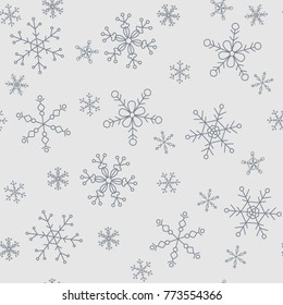 Snowflakes of different styles on a background of gray, pattern
