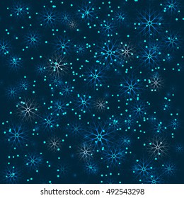 Snowflakes falling in the darkness.Christmas background