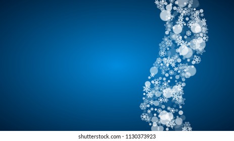 Snowflakes falling on blue background. Christmas and New Year horizontal theme. Frosty falling snowflakes for banners, gift card, party invitation, compliments and special business offer