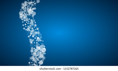 Snowflakes falling on blue background. Christmas and New Year horizontal theme. Frosty falling snowflakes for banners, gift card, party invitation, compliments and special business offer