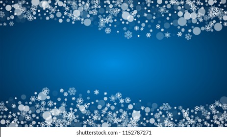 Snowflakes falling on blue background. Christmas and New Year horizontal theme. Frosty falling snowflakes for banners, gift card, party invitation, compliments and special business offer