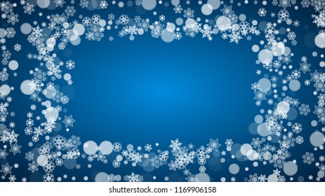 Snowflakes falling on blue background. Christmas and New Year horizontal theme. Frosty falling snowflakes for banners, gift card, party invitation, compliments and special business offer