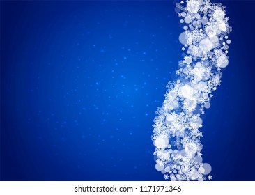 Snowflakes falling on blue background with sparkles. Christmas and New Year horizontal theme. Frosty falling snowflakes for banners, gift card, party invitation, compliments and special business offer