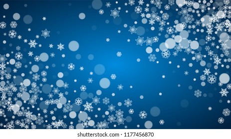 Snowflakes falling on blue background. Christmas and New Year horizontal theme. Frosty falling snowflakes for banners, gift card, party invitation, compliments and special business offer