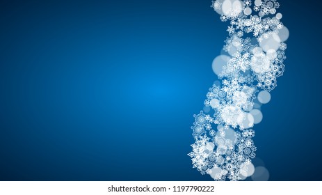 Snowflakes falling on blue background. Christmas and New Year horizontal theme. Frosty falling snowflakes for banners, gift card, party invitation, compliments and special business offer