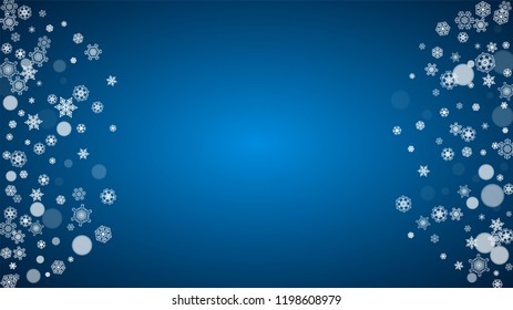 Snowflakes falling on blue background. Christmas and New Year horizontal theme. Frosty falling snowflakes for banners, gift card, party invitation, compliments and special business offer