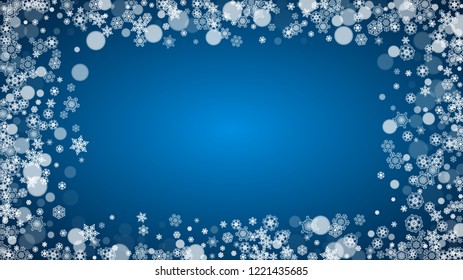 Snowflakes falling on blue background. Christmas and New Year horizontal theme. Frosty falling snowflakes for banners, gift card, party invitation, compliments and special business offer