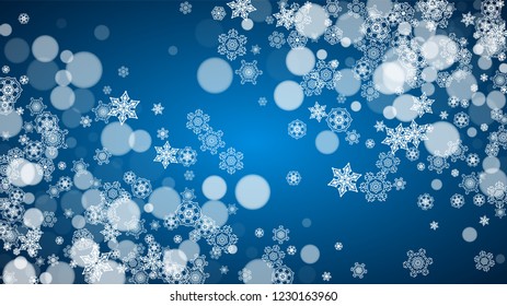 Snowflakes falling on blue background. Christmas and New Year horizontal theme. Frosty falling snowflakes for banners, gift card, party invitation, compliments and special business offer