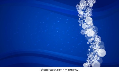 Snowflakes falling on blue background. Christmas and New Year horizontal theme. Frosty falling snowflakes for banners, gift card, party invitation, compliments and special business offer