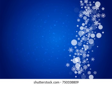 Snowflakes falling on blue background with sparkles. Christmas and New Year horizontal theme. Frosty falling snowflakes for banners, gift card, party invitation, compliments and special business offer
