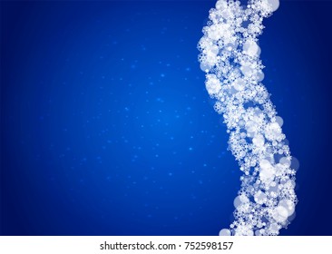 Snowflakes falling on blue background with sparkles. Christmas and New Year horizontal theme. Frosty falling snowflakes for banners, gift card, party invitation, compliments and special business offer