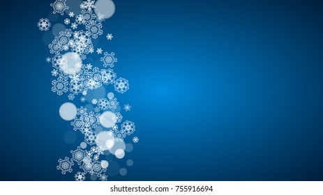 Snowflakes falling on blue background. Christmas and New Year horizontal theme. Frosty falling snowflakes for banners, gift card, party invitation, compliments and special business offer