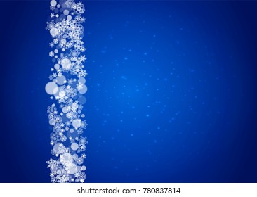 Snowflakes falling on blue background with sparkles. Christmas and New Year horizontal theme. Frosty falling snowflakes for banners, gift card, party invitation, compliments and special business offer