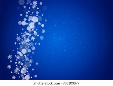 Snowflakes falling on blue background with sparkles. Christmas and New Year horizontal theme. Frosty falling snowflakes for banners, gift card, party invitation, compliments and special business offer