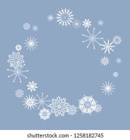 Snowflakes falling on a blue sky background. Winter vector background. The effect of decorating snowflakes. The winter vacation. Well suited for a Christmas card, banner or poster. EPS 10