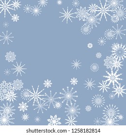 Snowflakes falling on a blue sky background. Winter vector background. The effect of decorating snowflakes. The winter vacation. Well suited for a Christmas card, banner or poster. EPS 10