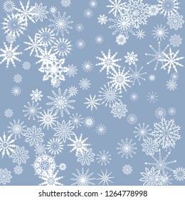 Snowflakes falling on a blue sky background. Winter vector background. The effect of decorating snowflakes. The winter vacation. Well suited for a Christmas card, banner or poster. EPS 10
