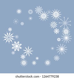 Snowflakes falling on a blue sky background. Winter vector background. The effect of decorating snowflakes. The winter vacation. Well suited for a Christmas card, banner or poster. EPS 10