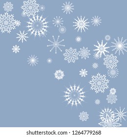 Snowflakes falling on a blue sky background. Winter vector background. The effect of decorating snowflakes. The winter vacation. Well suited for a Christmas card, banner or poster. EPS 10
