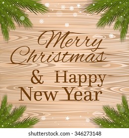Snowflakes falling on spruce branches. Merry Christmas and a Happy New Year.  Greeting inscription on the wooden background. Vector Christmas background.