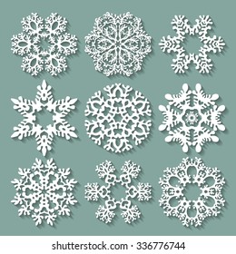 Snowflakes flat icon set collection. Nine carved varied snowflakes with long shadows. Illustration for Christmas and New Year design.