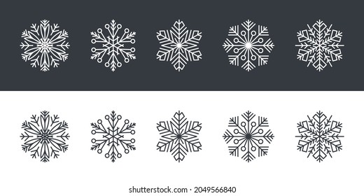 Copos de nieve. Copos de nieve de estilo plano sobre fondo blanco y negro. Ilustración del vector