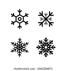 Copos de nieve. Cuatro copos de nieve de diseño plano. Copos de nieve aislados. Ilustración del vector