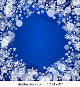 Snowflakes frame on blue background with sparkles. Merry Christmas and Happy New Year. Falling snowflakes frame for banners, gift cards, party invitation, partner compliment and special business offer