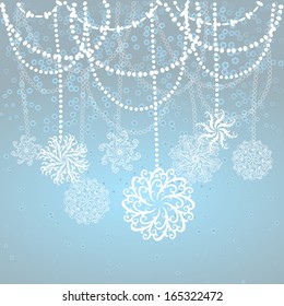 Snowflakes hang on chains of beads