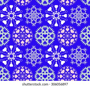 Snowflakes, heart view seamless pattern. Winter, Christmas, Valentine day, birthday texture. Stylized unusual light ornament with heart signs on blue background. Vector illustration.