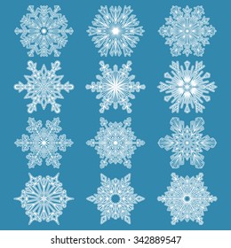 Snowflakes icon collection-1.  White snowflakes on a blue background. Graphic vector ornament