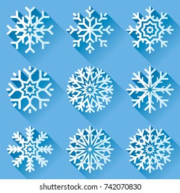 Snowflakes Icon Set In Flat Style On Blue Background. Ice Crystal. Vector Winter Design Element For You Christmas And New Year's Projects