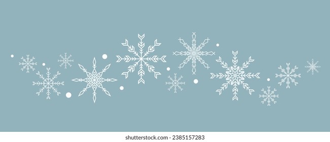 Schneeflocken einzeln auf blauem Hintergrund. Welle von Schneeflocken.
