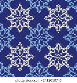 Snowflakes jacquard knitted seamless pattern. Winter stars blue and white background. Vector illustration.