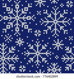 Snowflakes jacquard seamless pattern. Blue and white knitted background. Northern winter style. Vector illustration.