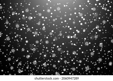Snowflakes on a black background. Vector Christmas or New Year background.