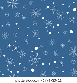 Snowflakes on blue background. Seamless pattern. Falling snow. Vector illustration.