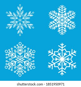 Snowflakes on a blue background. Set of four beautiful snowflakes. Design elements. 