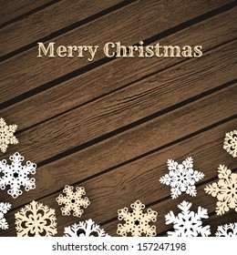 Snowflakes on wood background