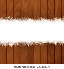 Snowflakes on wooden background.